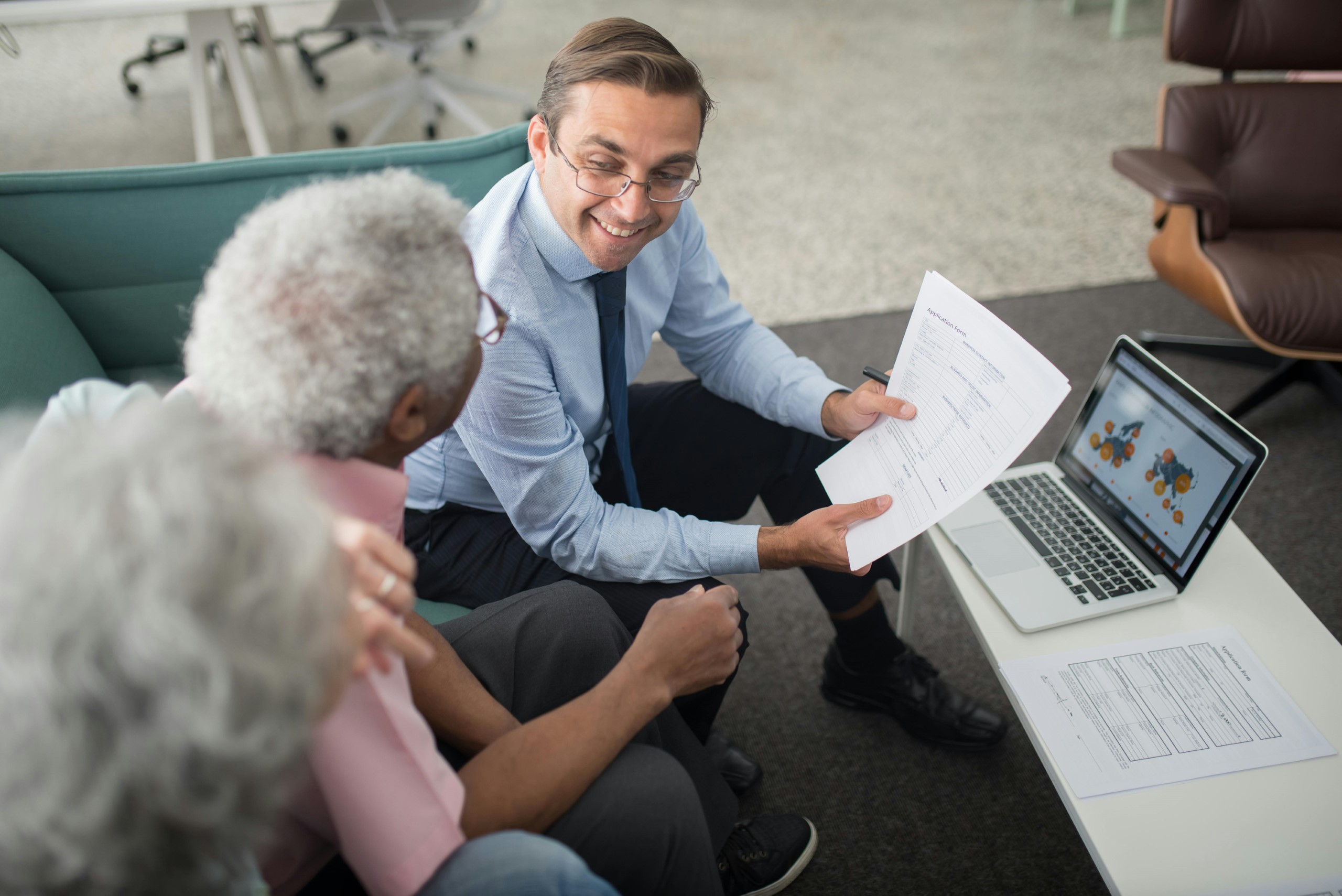 Person attending a seminar or reading updated financial material