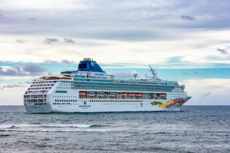 Cruise ship with some empty balconies, symbolizing unsold cabins