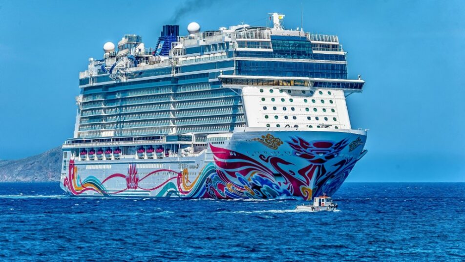 Laptop screen showing various cruise deal websites (generic logos)