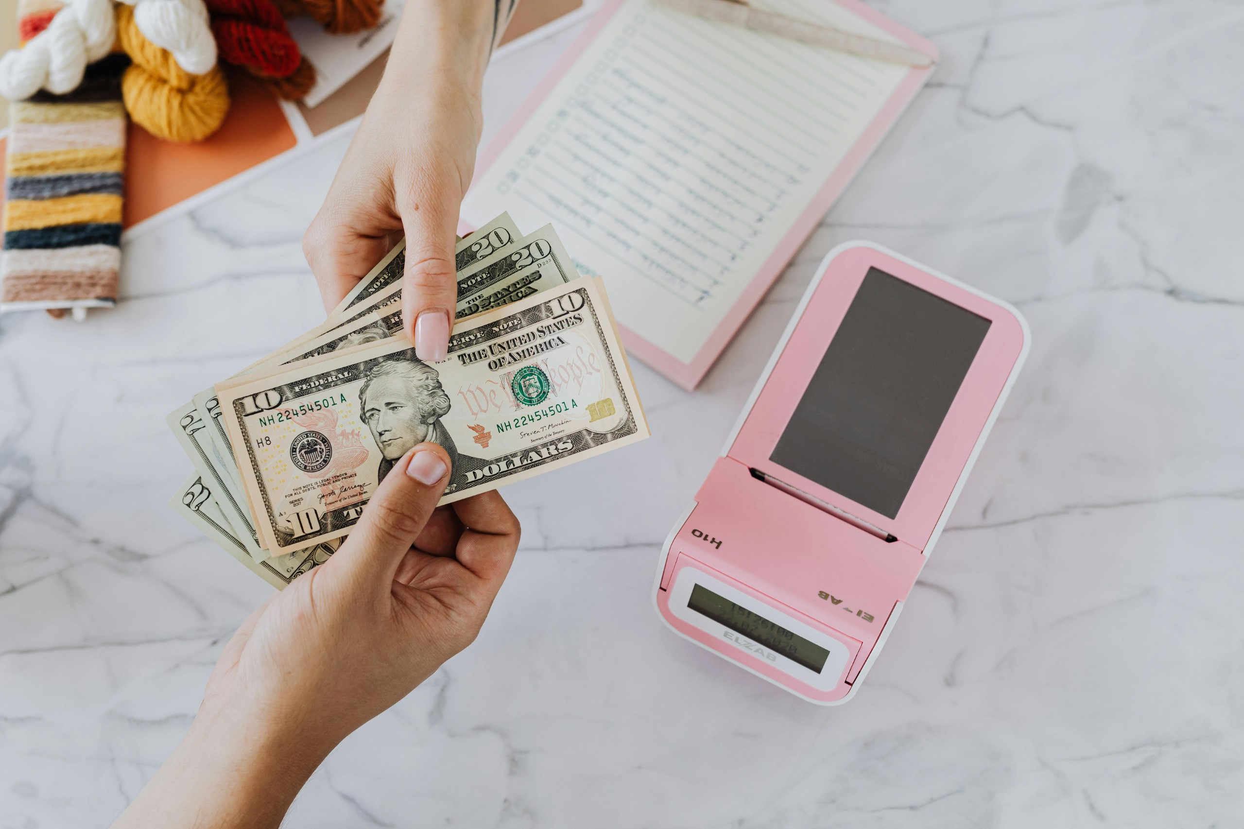 Person carefully weighing pros and cons before engaging in P2P lending