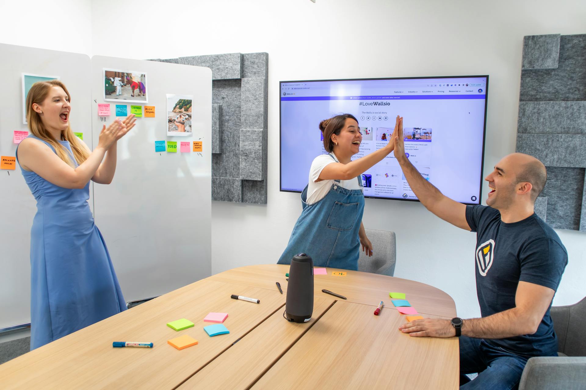 Diverse group of professionals collaborating strategically around a digital display