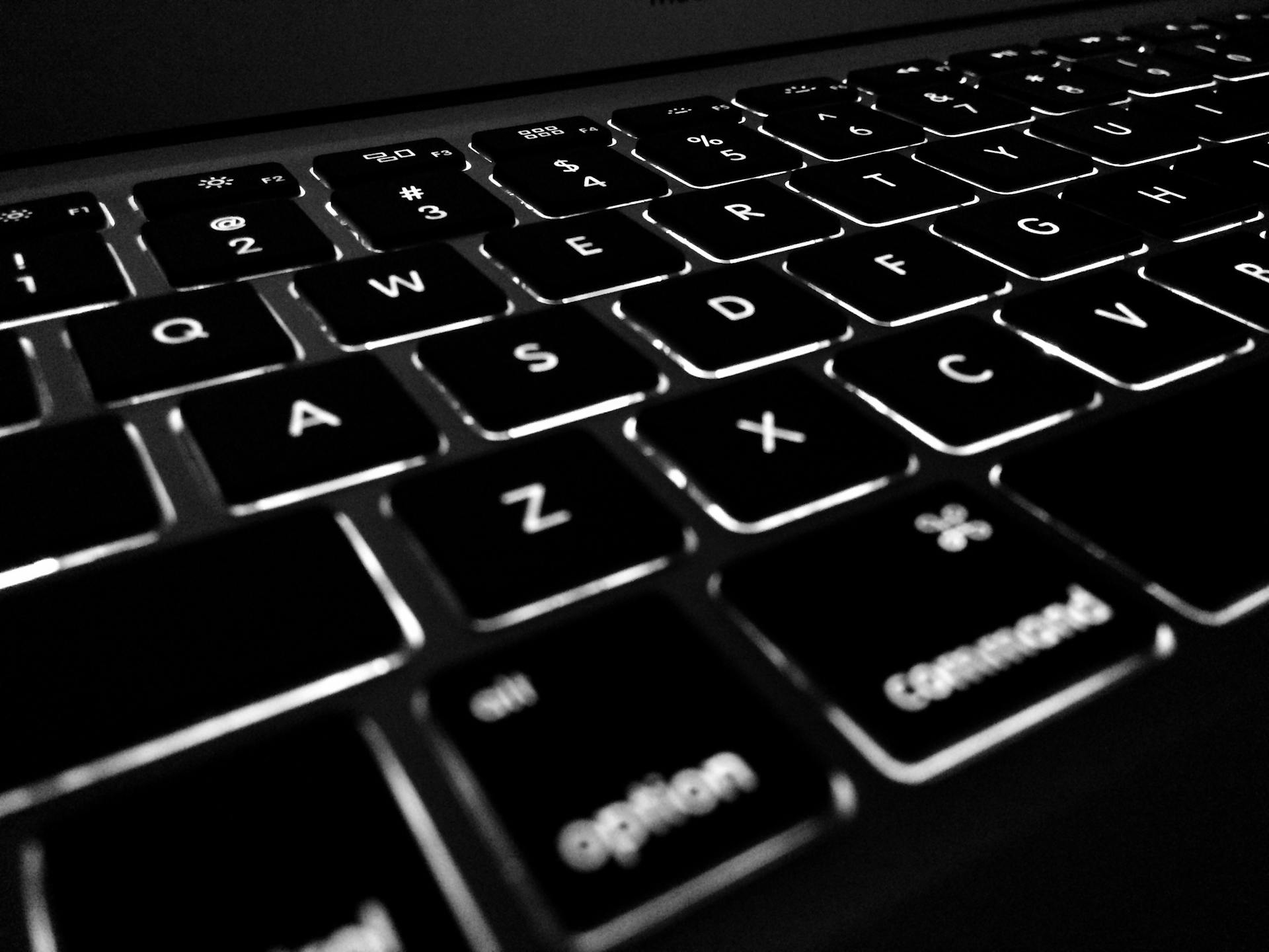 Person using a laptop with a web browser showing an online PDF editor interface