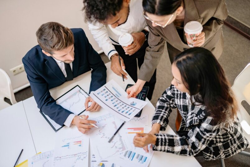 Person listing financial goals like retirement, house purchase, education savings